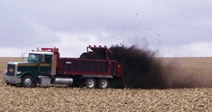 photo - spreading manure on field