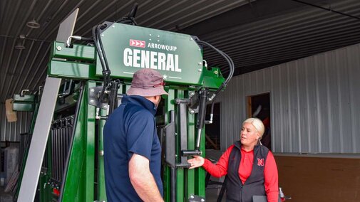 people looking at Arrowquip cattle chute
