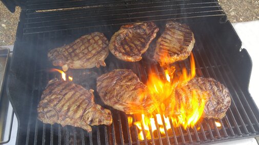 steak cooking on a grill