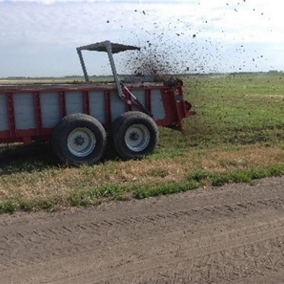 Manure spreader on field (Photo credit: Leslie Johnson)