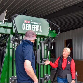 people looking at Arrowquip cattle chute