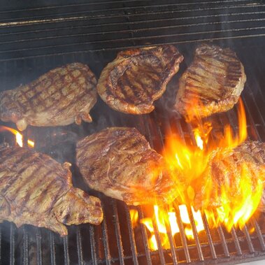 steak cooking on a grill