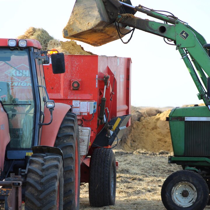 Tractor loads feeder wagon