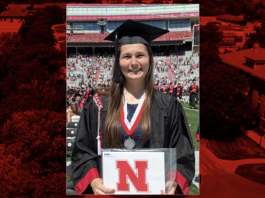 Anna Schmit holds a Nebraska diploma