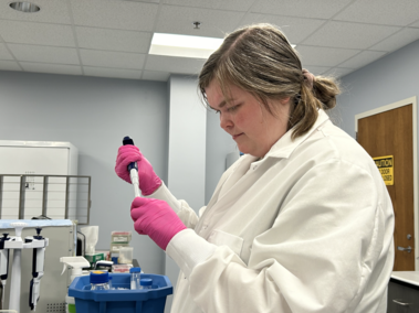 Mackenzie Batt studies beef genetics in a lab