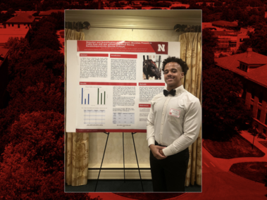 Marcus McCaskill with a research poster