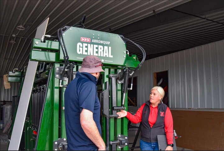 people looking at Arrowquip cattle chute