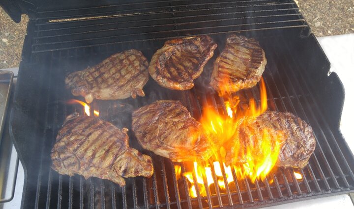 steak cooking on a grill